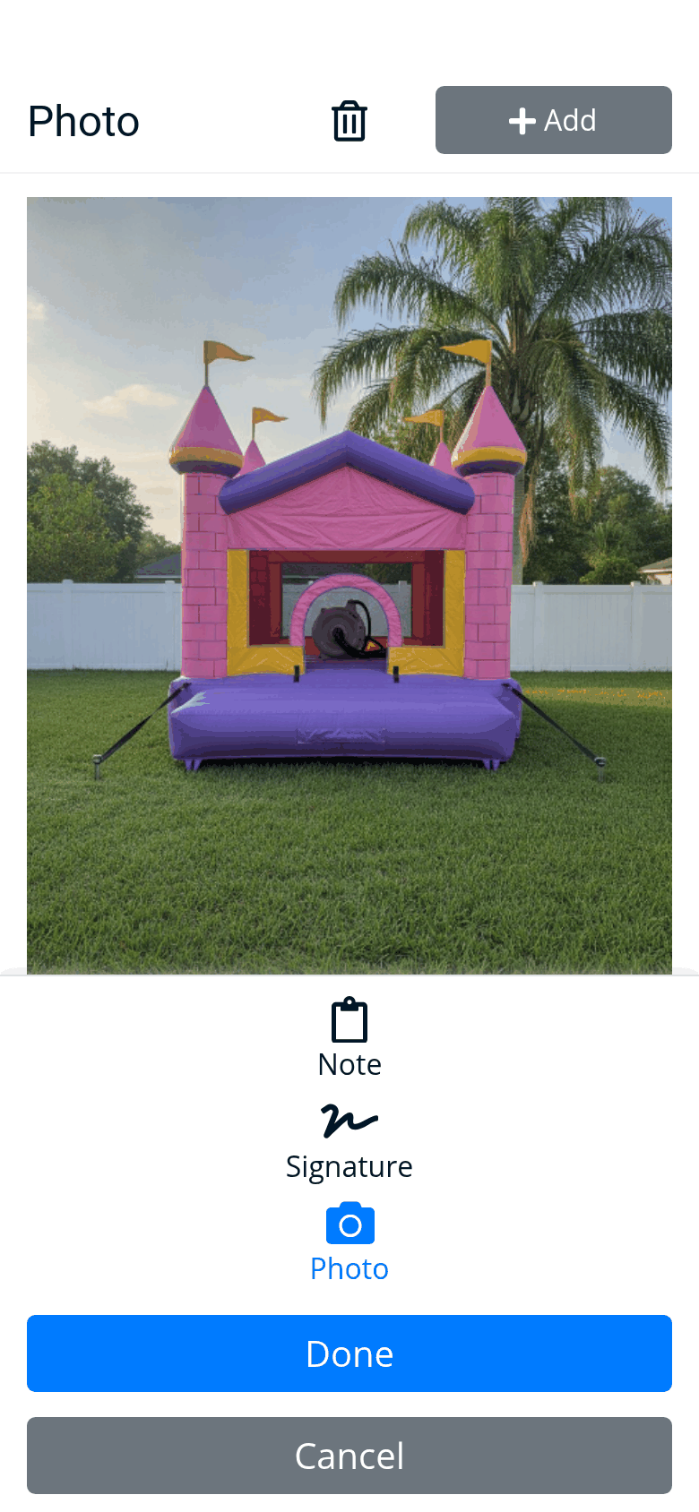 The driver app’s photo of the setup: the princess castle inflated and staked on the lawn