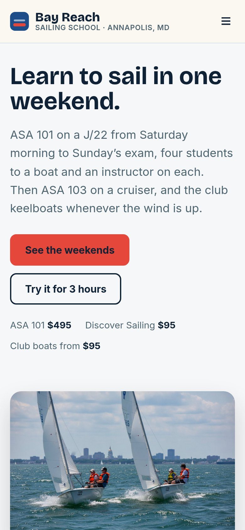 The Bay Reach Sailing School website on a phone: Learn to sail in one weekend.