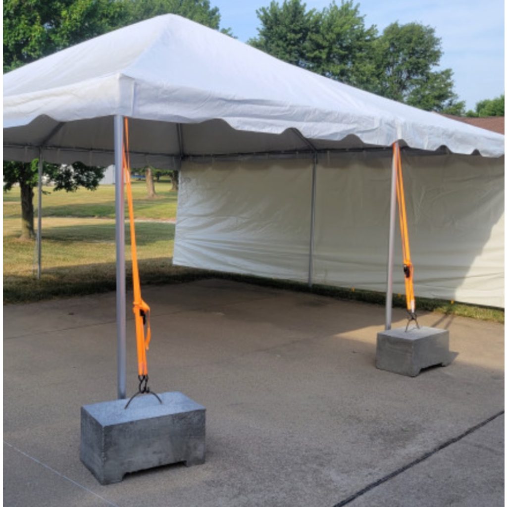 Tent leg tied to a concrete block
